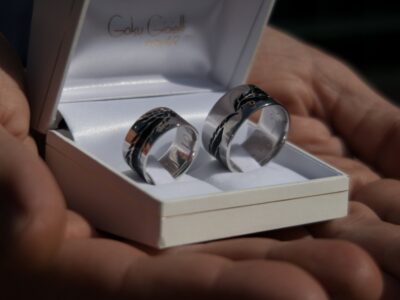 White gold wedding bands with dragon engraved and filled with black enamel